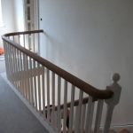 Hardwood handrailing to softwood cut string and bracketed staircase.